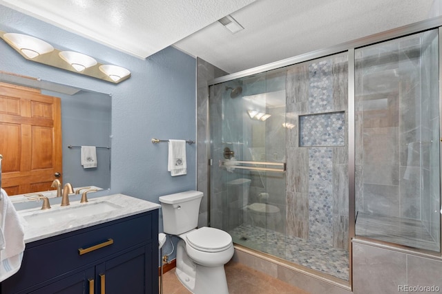 bathroom with toilet, a shower with shower door, a textured ceiling, vanity, and tile patterned flooring