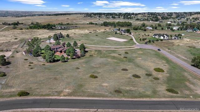 birds eye view of property with a rural view