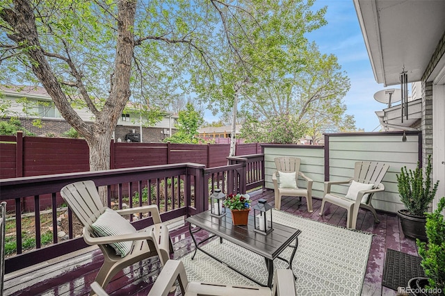 5252 W 68th Ave, Arvada, CO 80003 - wooden terrace featuring a fenced backyard and outdoor lounge area