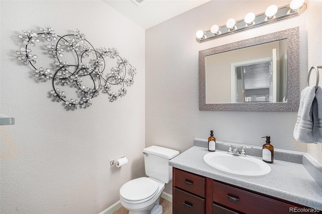 5252 W 68th Ave, Arvada, CO 80003 - bathroom with vanity, toilet, and baseboards