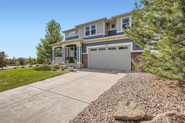 7485 S Jackson Gap Way, Aurora, CO 80016 - view of front of house featuring brick siding, driveway, covered porch, and a garage