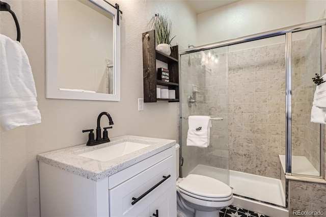 7485 S Jackson Gap Way, Aurora, CO 80016 - full bathroom featuring a shower stall, vanity, and toilet