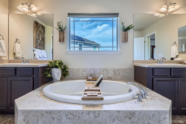 7485 S Jackson Gap Way, Aurora, CO 80016 - full bathroom featuring two vanities and a bath