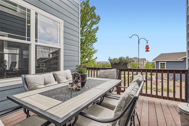 7485 S Jackson Gap Way, Aurora, CO 80016 - wooden terrace featuring outdoor dining area