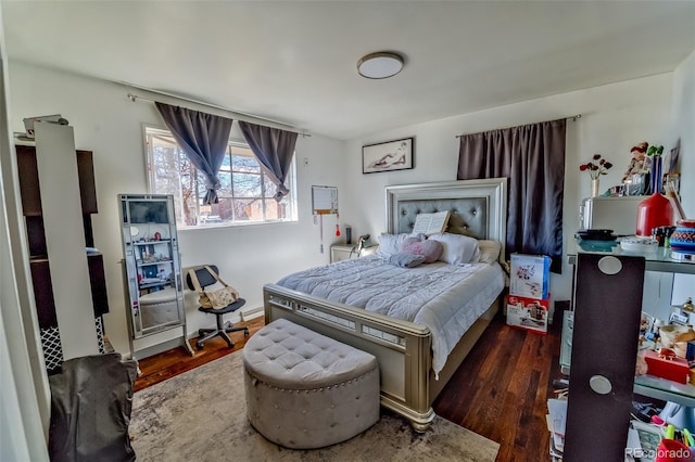 bedroom with wood finished floors