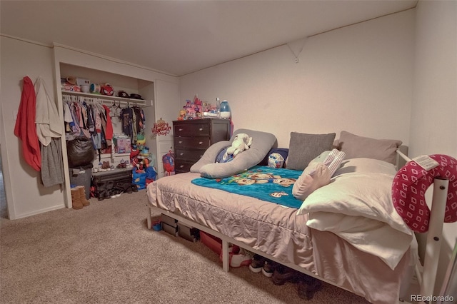 bedroom featuring a closet and carpet flooring