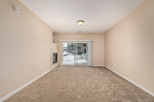 unfurnished living room featuring carpet floors