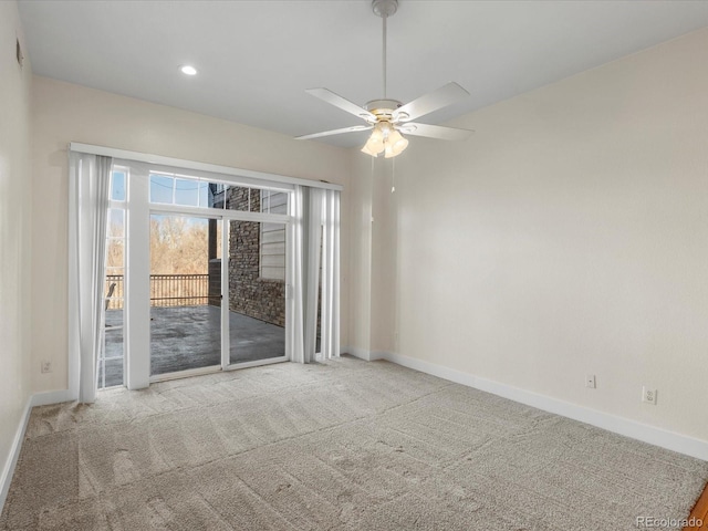 carpeted empty room featuring recessed lighting, a ceiling fan, and baseboards