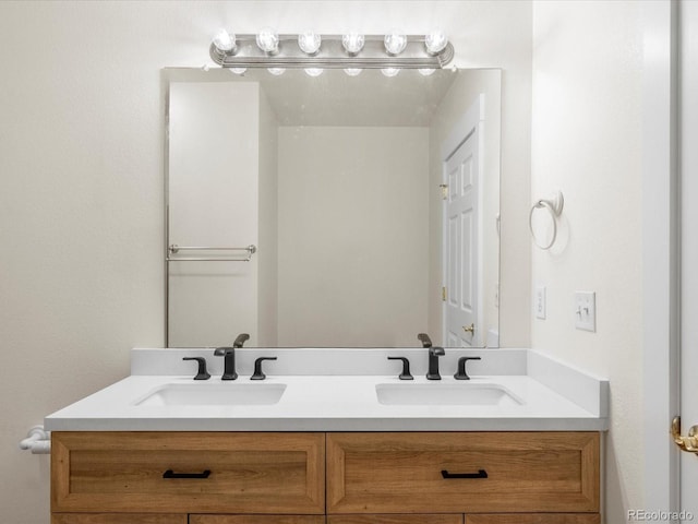 bathroom with double vanity and a sink