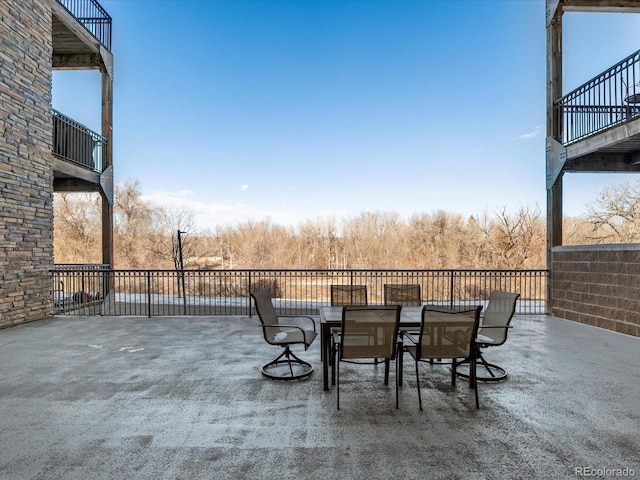 view of patio / terrace with outdoor dining area and a balcony