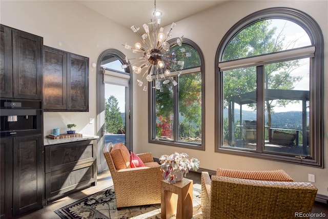 28154 Belle Mont Trl, Conifer, CO 80433 - dining area featuring a chandelier and plenty of natural light