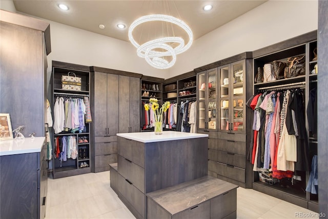 28154 Belle Mont Trl, Conifer, CO 80433 - spacious closet with a chandelier and light tile patterned floors