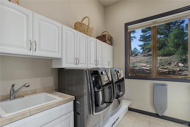 28154 Belle Mont Trl, Conifer, CO 80433 - washroom with cabinet space, washer and dryer, and light tile patterned flooring