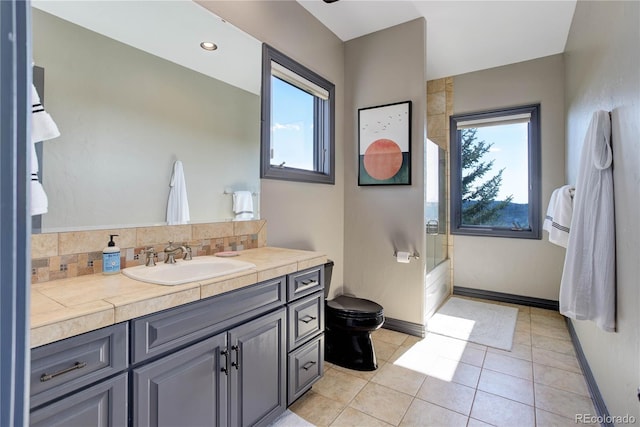 28154 Belle Mont Trl, Conifer, CO 80433 - bathroom with plenty of natural light, vanity, tile patterned flooring, and bath / shower combo with glass door