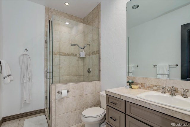 28154 Belle Mont Trl, Conifer, CO 80433 - bathroom featuring vanity, a shower stall, toilet, tile patterned floors, and recessed lighting