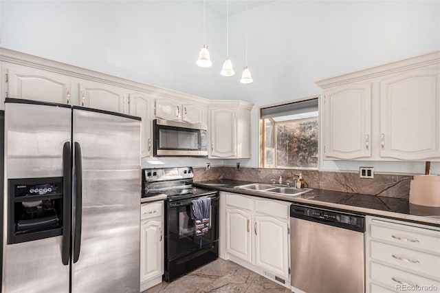 kitchen featuring appliances with stainless steel finishes, white cabinetry, and sink