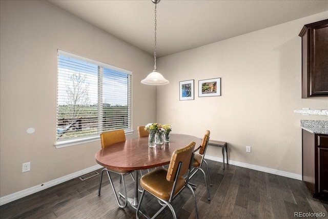 dining space featuring baseboards, dark wood-style flooring, and visible vents