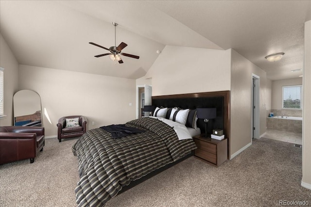 bedroom with baseboards, vaulted ceiling, and light carpet