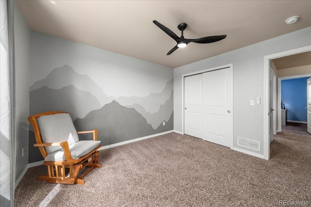 living area featuring carpet flooring, a ceiling fan, baseboards, and visible vents