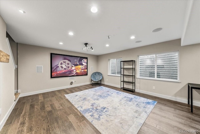cinema room featuring baseboards, recessed lighting, and wood finished floors
