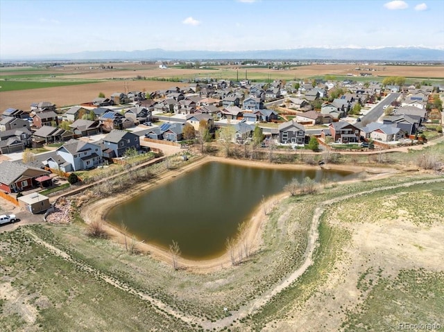 bird's eye view featuring a residential view and a water view