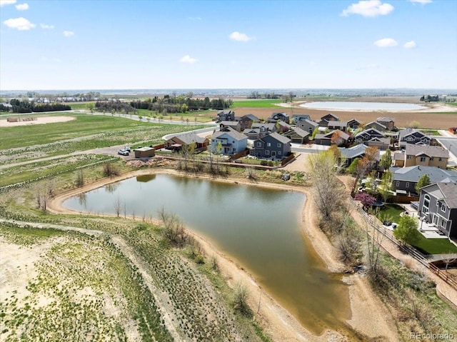 aerial view with a water view and a residential view