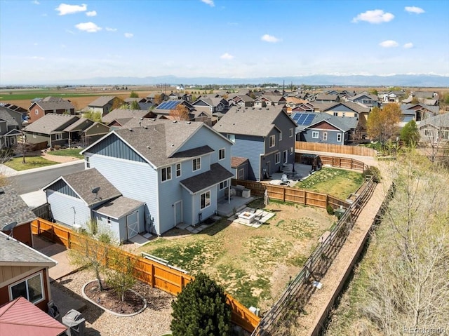 birds eye view of property with a residential view