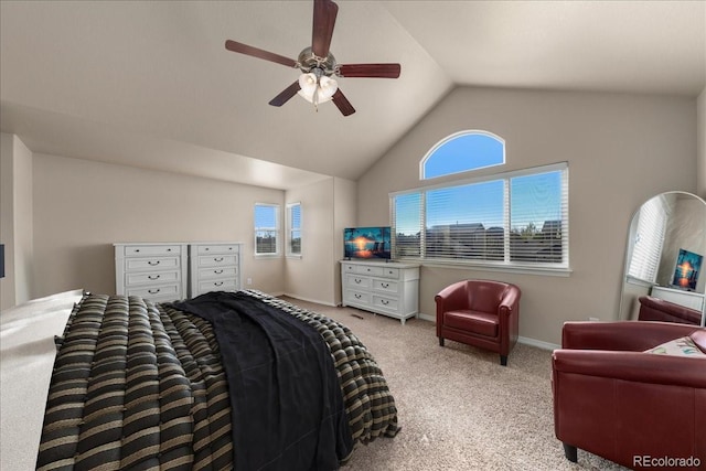 carpeted bedroom with baseboards, ceiling fan, and vaulted ceiling