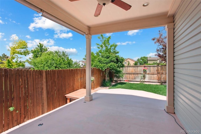 5740 S Tempe Ct, Aurora, CO 80015 - fenced backyard featuring ceiling fan and a patio area