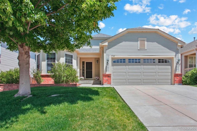 5740 S Tempe Ct, Aurora, CO 80015 - view of front of house with a garage, brick siding, driveway, and a front lawn