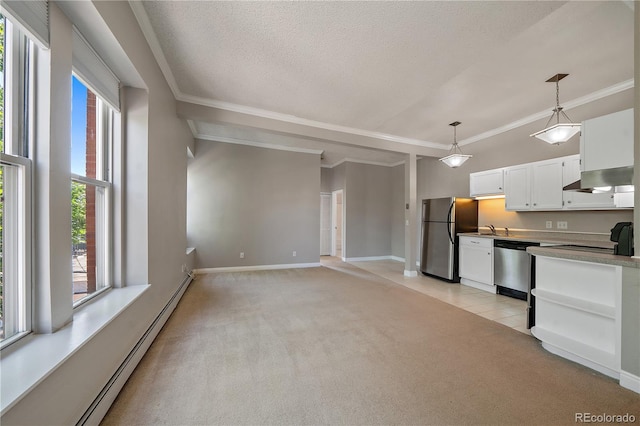 kitchen featuring light carpet, a baseboard heating unit, white cabinets, hanging light fixtures, and stainless steel appliances