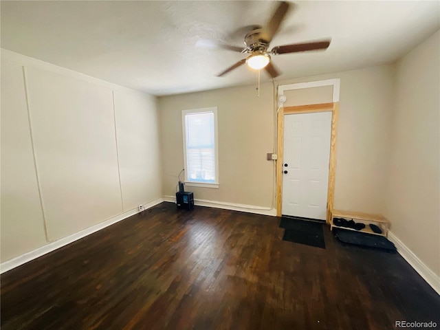 unfurnished room featuring dark hardwood / wood-style floors and ceiling fan