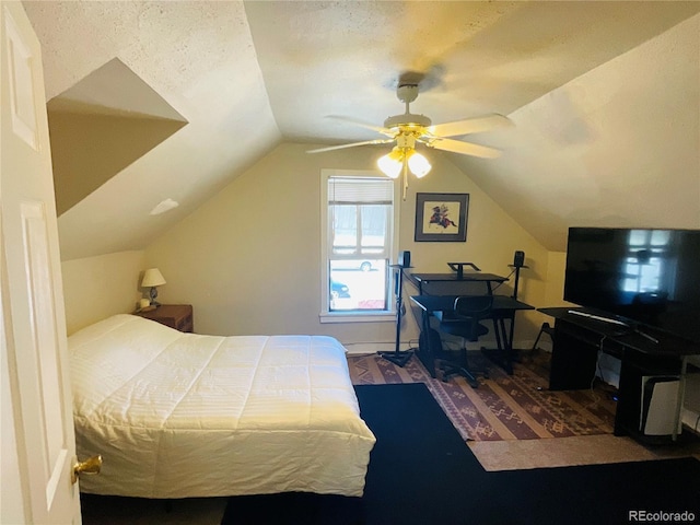 bedroom with ceiling fan and lofted ceiling