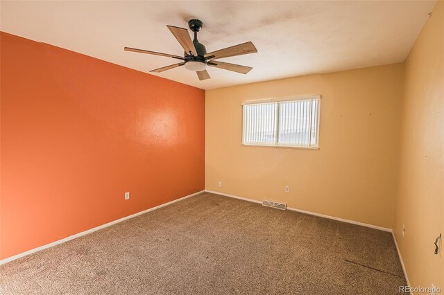 empty room with carpet flooring and ceiling fan