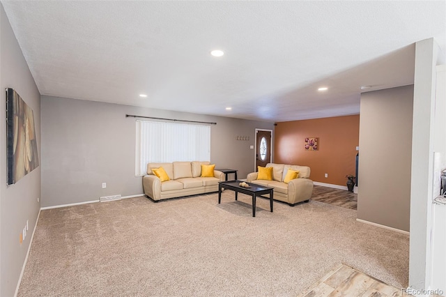 living room with light colored carpet