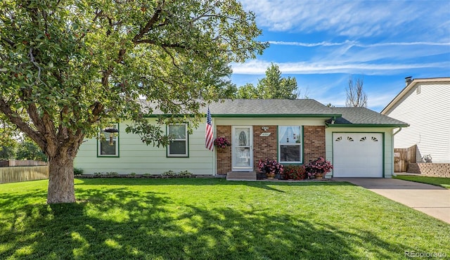 single story home with a garage and a front lawn