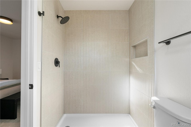 full bathroom with a shower stall and toilet