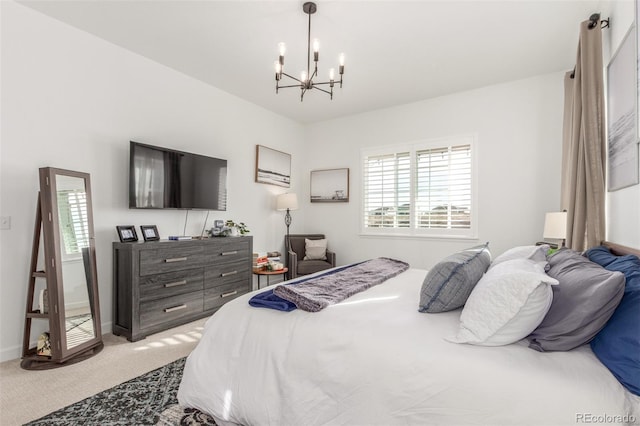 bedroom with a notable chandelier, baseboards, and light carpet