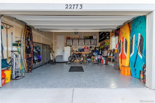 garage featuring freestanding refrigerator