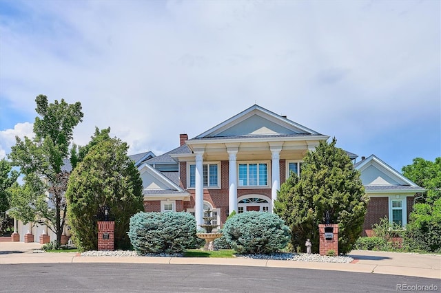 8717 Ridgepoint Dr, Castle Pines, CO 80108 - neoclassical / greek revival house with brick siding