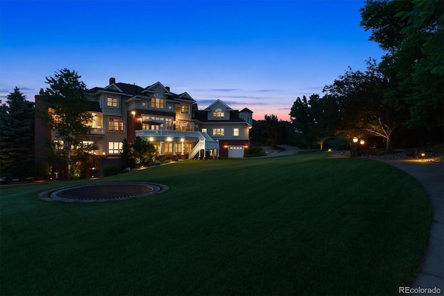 8717 Ridgepoint Dr, Castle Pines, CO 80108 - view of green lawn with a balcony and a garage