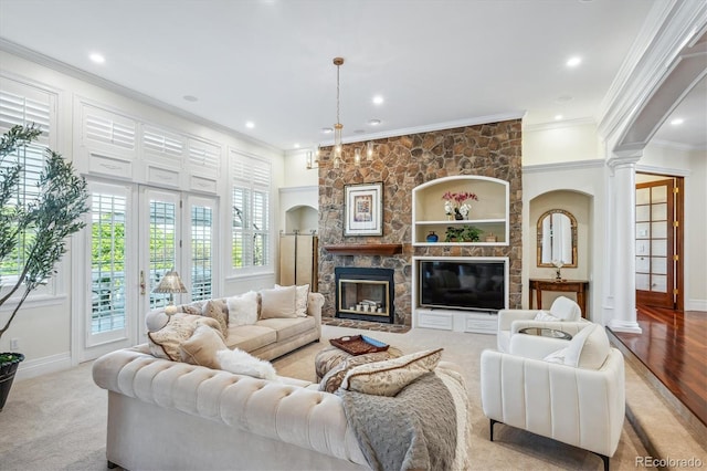 8717 Ridgepoint Dr, Castle Pines, CO 80108 - living room with decorative columns, ornamental molding, recessed lighting, and a fireplace