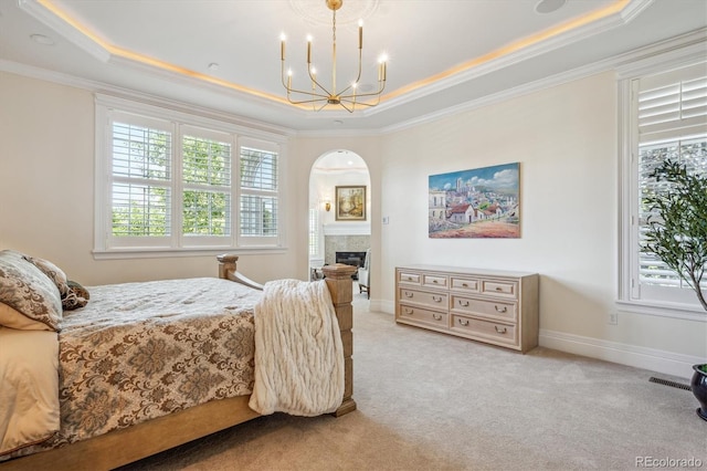 8717 Ridgepoint Dr, Castle Pines, CO 80108 - bedroom featuring a raised ceiling, multiple windows, a chandelier, and crown molding