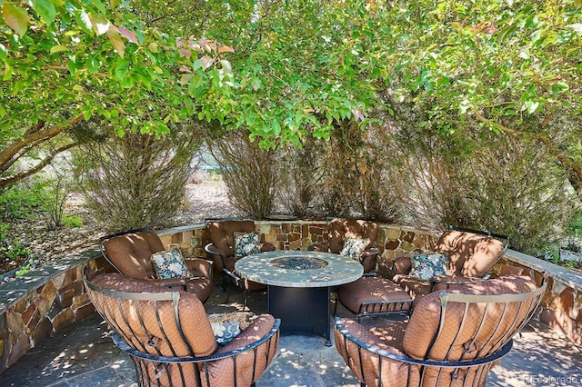 8717 Ridgepoint Dr, Castle Pines, CO 80108 - view of patio with an outdoor fire pit