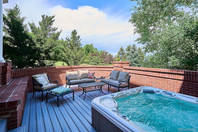 8717 Ridgepoint Dr, Castle Pines, CO 80108 - wooden deck with a hot tub and an outdoor living space
