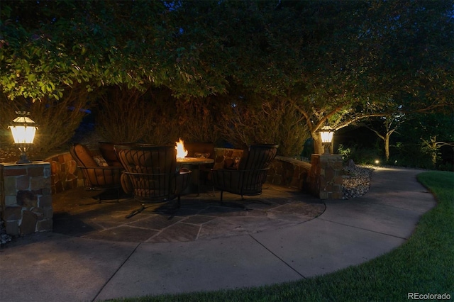 8717 Ridgepoint Dr, Castle Pines, CO 80108 - view of patio / terrace with a fire pit
