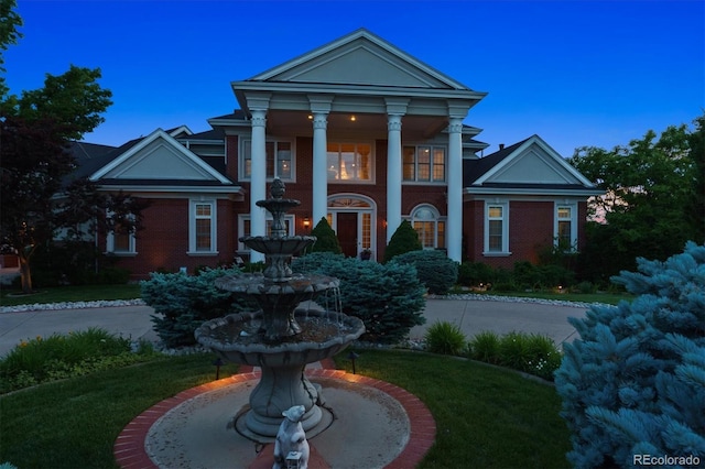 8717 Ridgepoint Dr, Castle Pines, CO 80108 - greek revival inspired property with a front yard and brick siding