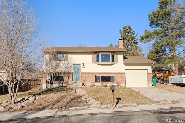 raised ranch featuring a garage