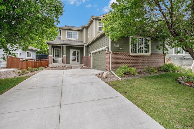 3389 Willowrun Dr, Castle Rock, CO 80109 - view of front of house featuring brick siding, a porch, and driveway