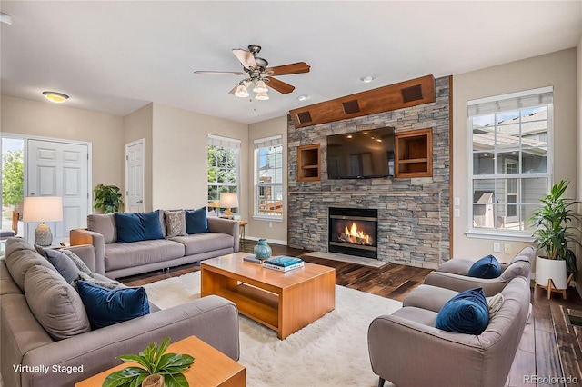 3389 Willowrun Dr, Castle Rock, CO 80109 - living room with wood finished floors, ceiling fan, and a fireplace